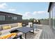 Relax on this rooftop deck featuring a sofa and city views for outdoor living at 1816 Rosette Way, Indianapolis, IN 46202