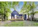 Charming home with a backyard, features a wooden deck and well-maintained lawn at 1822 Howard St, Indianapolis, IN 46221