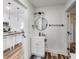 Bathroom and kitchen featuring white cabinets at 1822 Howard St, Indianapolis, IN 46221