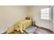 Bedroom features wood floors, natural light, and a bed at 1822 Howard St, Indianapolis, IN 46221