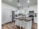 Bright kitchen with a central island, stylish pendant lighting, and modern appliances for cooking at 1822 Howard St, Indianapolis, IN 46221