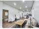 Spacious open-concept living area featuring hardwood floors, plush seating, and ample natural light at 1822 Howard St, Indianapolis, IN 46221