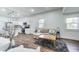 Open-concept living space with hardwood floors, a cozy sectional, and a seamless transition to the kitchen at 1822 Howard St, Indianapolis, IN 46221