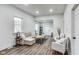 Bright living room with hardwood floors, a comfortable sectional, and an abundance of natural light at 1822 Howard St, Indianapolis, IN 46221