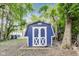 View of the blue and white backyard storage shed at 1822 Howard St, Indianapolis, IN 46221
