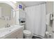 Clean bathroom featuring modern fixtures, a vanity with storage, and a well-maintained shower area at 1907 N Drexel Ave, Indianapolis, IN 46218