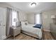 Comfortable bedroom featuring neutral colors, ample natural light, and modern decor elements at 1907 N Drexel Ave, Indianapolis, IN 46218