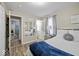 Cozy bedroom enhanced by light colors, stylish furnishings, and a relaxing atmosphere at 1907 N Drexel Ave, Indianapolis, IN 46218