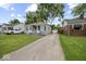 Features a detached garage and a long driveway at 1907 N Drexel Ave, Indianapolis, IN 46218