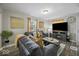 Bright living room with a decorative fireplace and plush seating at 1907 N Drexel Ave, Indianapolis, IN 46218