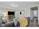 Cozy living room showcasing stylish decor, adjacent bathroom and hallway at 1907 N Drexel Ave, Indianapolis, IN 46218