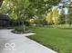Large backyard with expansive lawn and wooden fence at 1941 Spruce Dr, Carmel, IN 46033