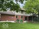 Spacious backyard with a patio area, mature trees, and a well-maintained lawn, perfect for outdoor entertaining at 1941 Spruce Dr, Carmel, IN 46033