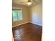 Neutral bedroom featuring a ceiling fan and a window for natural light and comfortable living space at 1941 Spruce Dr, Carmel, IN 46033
