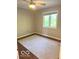 Neutral bedroom featuring a ceiling fan and a window for natural light and comfortable living space at 1941 Spruce Dr, Carmel, IN 46033