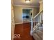 Inviting entryway with hardwood floors and staircase at 1941 Spruce Dr, Carmel, IN 46033