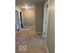 Hallway showing neutral carpet and walls with access to other rooms at 1941 Spruce Dr, Carmel, IN 46033