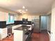 Bright kitchen with white cabinets, stainless steel appliances, and a large island at 1941 Spruce Dr, Carmel, IN 46033