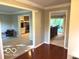 Open-concept layout connecting the living room to the screened porch at 1941 Spruce Dr, Carmel, IN 46033