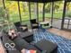 Cozy sunroom with comfortable seating and beautiful backyard views at 1941 Spruce Dr, Carmel, IN 46033