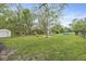 A large grassy backyard with playground equipment and an above ground swimming pool at 2 S 25Th Ave, Beech Grove, IN 46107