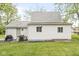 A backyard view of a home with a grill, shed with door and two windows in the back at 2 S 25Th Ave, Beech Grove, IN 46107
