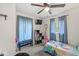 Bedroom with a ceiling fan and blue curtains at 2 S 25Th Ave, Beech Grove, IN 46107