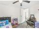 Bright bedroom with fun décor, a ceiling fan and access to the hallway at 2 S 25Th Ave, Beech Grove, IN 46107