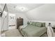 Cozy bedroom featuring comfortable furnishings and an attached bath at 2 S 25Th Ave, Beech Grove, IN 46107