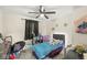 Brightly decorated bedroom with black out curtains and ceiling fan at 2 S 25Th Ave, Beech Grove, IN 46107