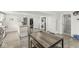 Open kitchen features an island with seating, modern appliances, and neutral-toned flooring at 2 S 25Th Ave, Beech Grove, IN 46107