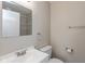 Cozy bathroom boasts clean vanity, toilet, modern lighting, and fresh accents at 203 S 17Th Ave, Beech Grove, IN 46107