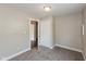 Spacious bedroom with neutral walls, soft carpet, closet, and doorway to other rooms at 203 S 17Th Ave, Beech Grove, IN 46107