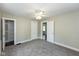 Bright bedroom features neutral walls, plush carpet, and multiple closets for storage at 203 S 17Th Ave, Beech Grove, IN 46107