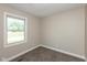 Bright bedroom features neutral walls, carpeted floor, and natural light from a window at 203 S 17Th Ave, Beech Grove, IN 46107
