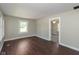 Cozy room featuring hardwood floors and a neutral color scheme at 203 S 17Th Ave, Beech Grove, IN 46107