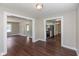 Open-concept view into the kitchen and living spaces featuring hardwood floors at 203 S 17Th Ave, Beech Grove, IN 46107