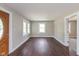 Bright living room featuring beautiful hardwood floors and large windows at 203 S 17Th Ave, Beech Grove, IN 46107