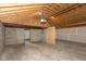 Spacious unfinished basement with concrete floor and exposed wood frame at 203 S 17Th Ave, Beech Grove, IN 46107