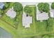 Bird's eye view showcases backyard next to lake, highlighting landscape layout and proximity to water feature at 2070 Mustang Chase Dr, Carmel, IN 46074
