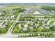 Wide aerial perspective of a community centered around a pond and surrounded by residential homes and green landscapes at 2070 Mustang Chase Dr, Carmel, IN 46074