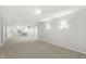 Finished basement area with lighting, wall sconces and a bar counter at 2070 Mustang Chase Dr, Carmel, IN 46074