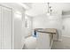 Basement bar area featuring a granite counter and built-in beverage cooler at 2070 Mustang Chase Dr, Carmel, IN 46074