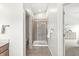 Neutral bathroom with glass shower, tile flooring, and view to the bedroom at 2070 Mustang Chase Dr, Carmel, IN 46074