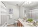 Bathroom with a double vanity, patterned shower curtain, and neutral paint at 2070 Mustang Chase Dr, Carmel, IN 46074