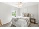 Comfortable bedroom features a soft color scheme, plush carpeting, and a bright window at 2070 Mustang Chase Dr, Carmel, IN 46074