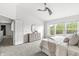 Bright bedroom featuring a ceiling fan and a dresser with natural light at 2070 Mustang Chase Dr, Carmel, IN 46074