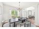 Open dining area with a view of the foyer and living spaces, showcasing the home's flowing design at 2070 Mustang Chase Dr, Carmel, IN 46074