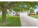 Beautiful home featuring a well-maintained lawn and a spacious driveway leading to an attached garage at 2070 Mustang Chase Dr, Carmel, IN 46074