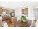 Open kitchen and dining area featuring stainless appliances, kitchen island, and seamless flow for entertaining at 2070 Mustang Chase Dr, Carmel, IN 46074